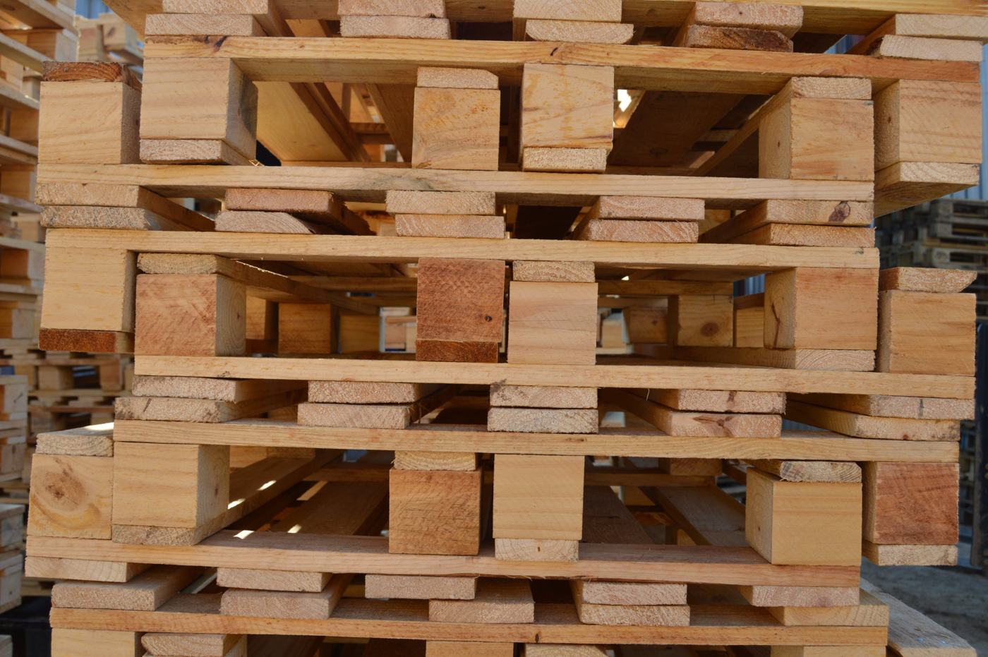 Stacks of new four-way wooden pallets