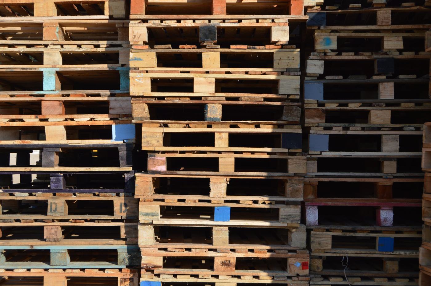 Stacks of second-hand recycled pallets