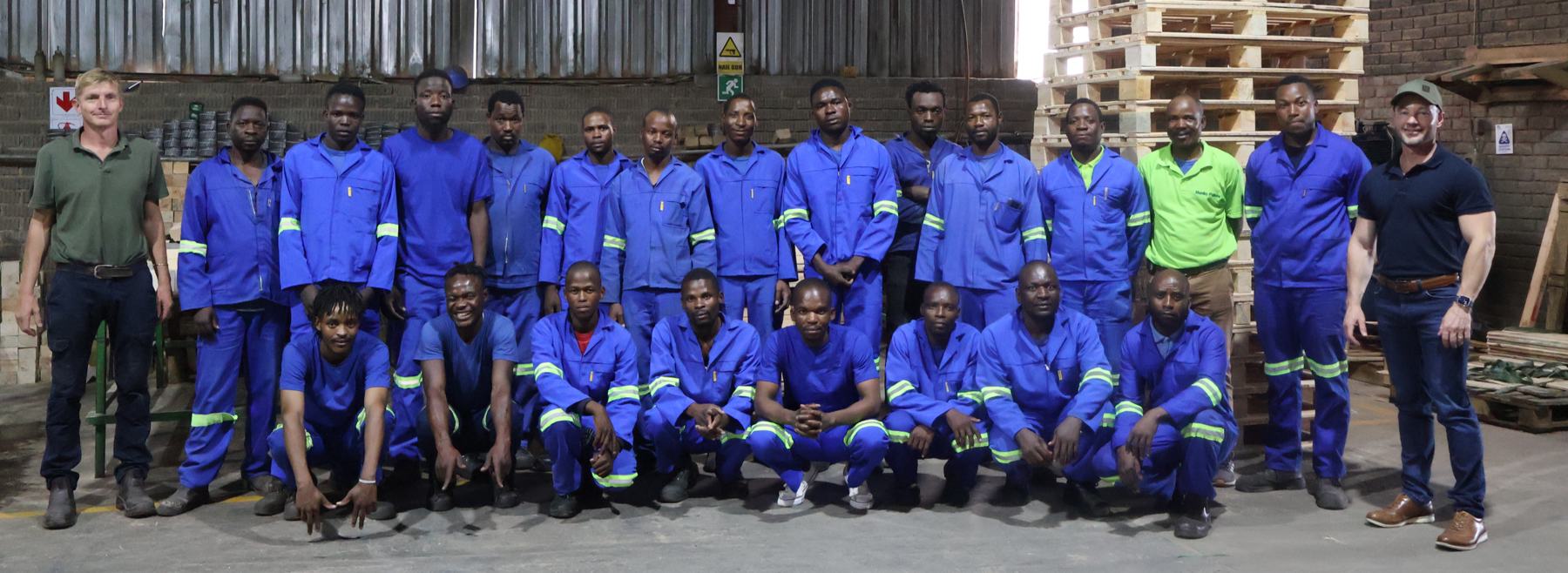 The Hunky Pallets team standing together on the factory floor