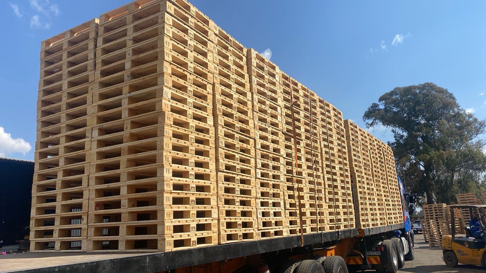 Flatbed truck loaded with pallets